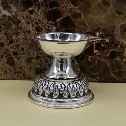 Sterling silver oil lamp with intricate chitai and kandrai work, traditional silver Deepak for puja and temple decor.