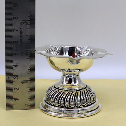 Sterling silver Chitai work oil lamp, traditional Deepak with intricate design, used as a temple and puja utensil, artisanal craft.