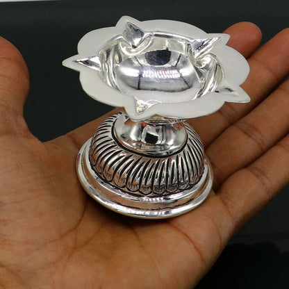 Sterling silver oil lamp with chitai and kandrai work, traditional deepak for puja, detailed silver temple art figurine.