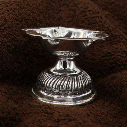 Sterling silver oil lamp with intricate chitai and kandrai work, detailed silver Deepak for puja and temple rituals.