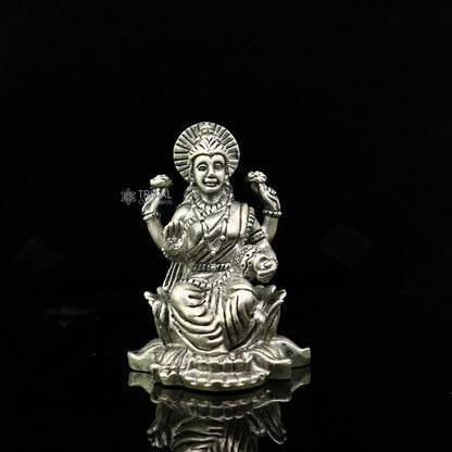 925 silver Goddess Lakshmi statue figurine for puja, depicting Lakshmi goddess symbolizing wealth and prosperity, suitable for Diwali worship.