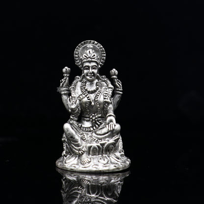 925 silver Goddess Lakshmi statue figurine for puja, symbol of wealth and prosperity, crafted by TRIBAL ORNAMENTS.