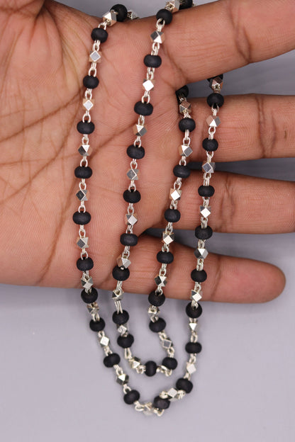 Handcrafted 925 silver Black Basil rosary beads with silver beads on a necklace chain, used in Ayurveda for protection and focus.