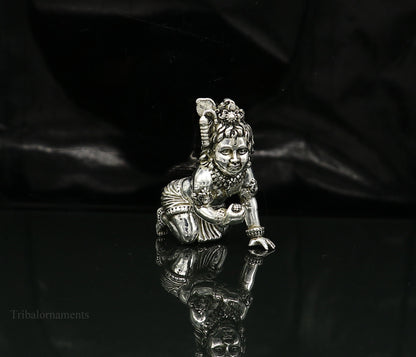 Small handmade 925 silver Krishna idol sculpture featuring crawling Ladu Gopal, perfect for home temple puja decor.