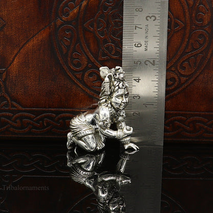Small handmade 925 silver Krishna idol sculpture, crawling Ladu Gopal for home temple puja and decorative art.