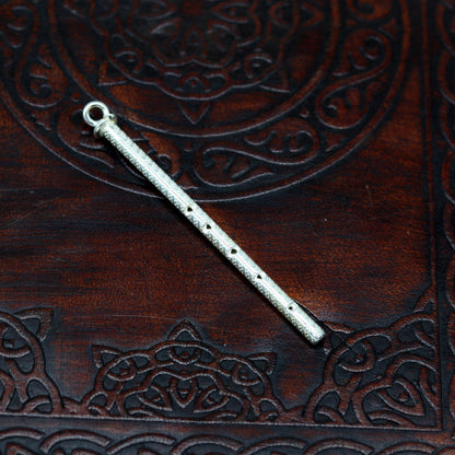 Handmade sterling silver Krishna idol with flute, featuring detailed craftsmanship, perfect for gifting or religious decor.