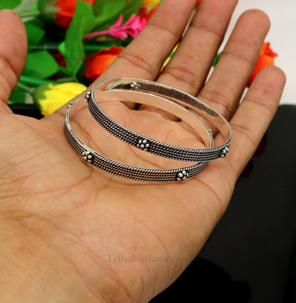Sterling silver customized bangle bracelet with intricate design by TRIBAL ORNAMENTS, stylish jewelry for brides and special gifting.