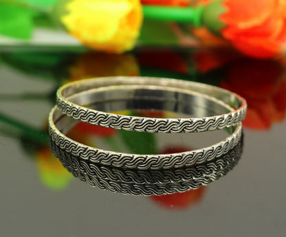 Sterling silver tribal-designed bangle bracelet by Tribal Ornaments, featuring intricate craftsmanship and stylish jewelry for gifting.