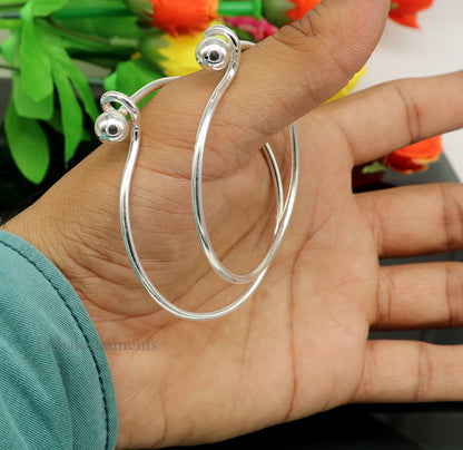 Sterling silver TRIBAL ORNAMENTS bangle bracelet with plain and ball work design, stylish and customizable jewelry for women.