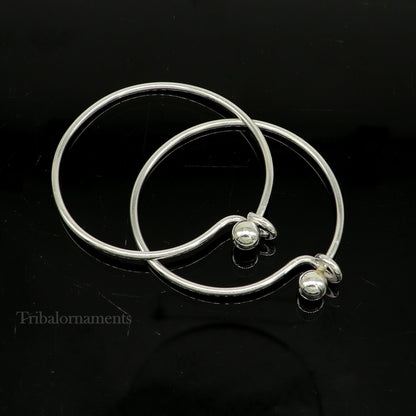 Sterling silver tribal-designed bangle bracelet with plain and ball work pattern, stylish jewelry for gifting or special occasions.