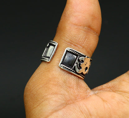 Sterling silver adjustable Shiva mantra thumb ring featuring 11mm solid handcrafted idol with OM Namah Shivay inscription.