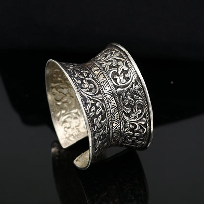 Sterling silver tribal cuff bracelet with adjustable design, ethnic boho style, ideal for wedding or Navratri jewelry.
