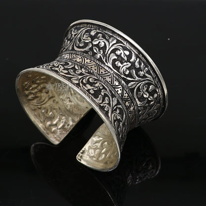 Sterling silver tribal cuff bracelet with adjustable fit, boho ethnic design, suitable for wedding or Navratri jewelry.