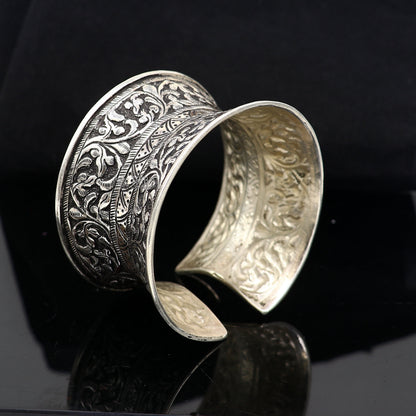 Sterling silver tribal cuff bracelet with adjustable fit, featuring ethnic boho design, ideal for weddings and Navratri jewelry.