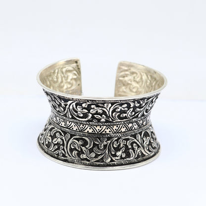 Sterling silver tribal cuff bracelet with adjustable fit, ethnic boho design, ideal for wedding or Navratri jewelry styles.