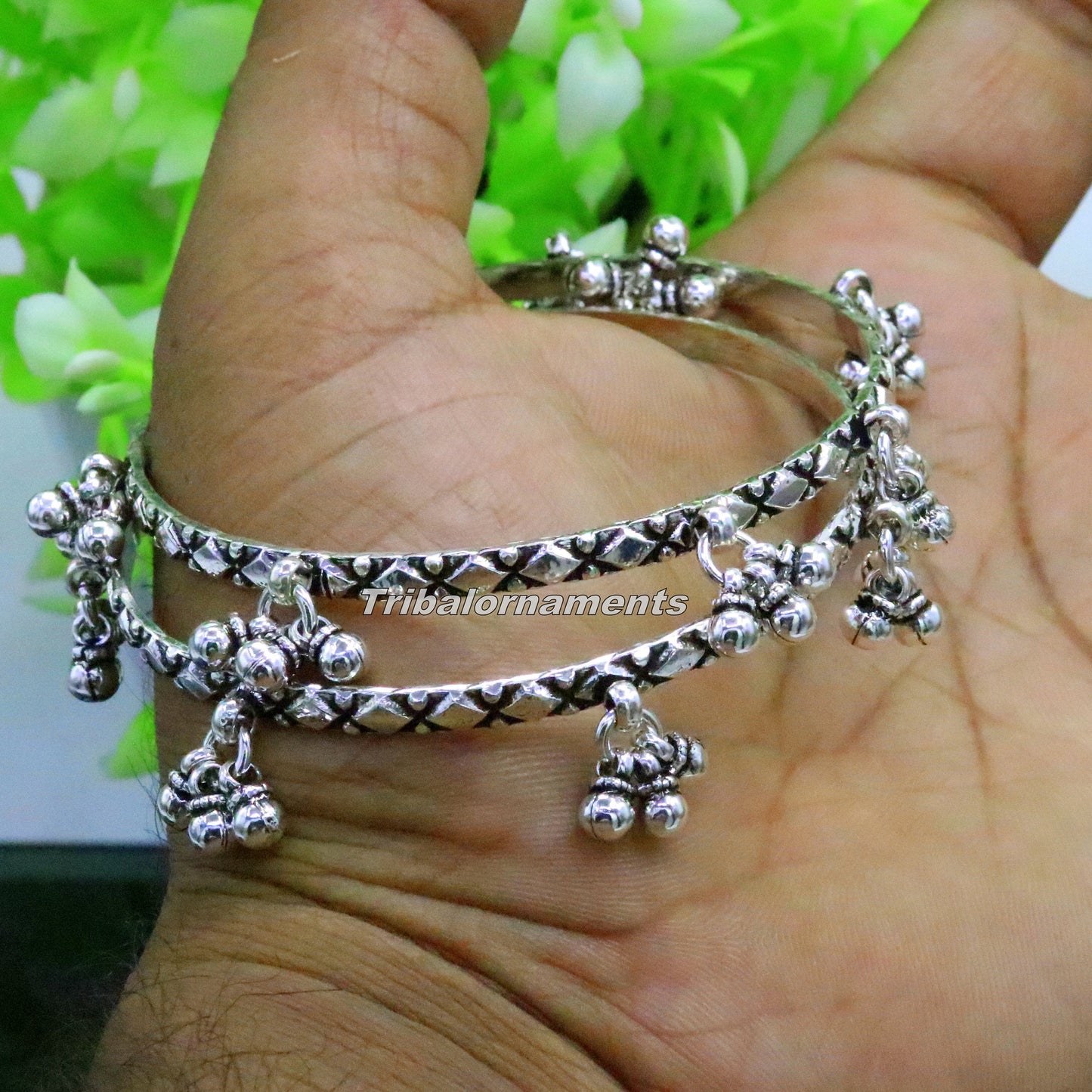 Sterling silver charm bangle bracelet by TRIBAL ORNAMENTS with oxidized finish, personalized belly dance jewelry with intricate design.