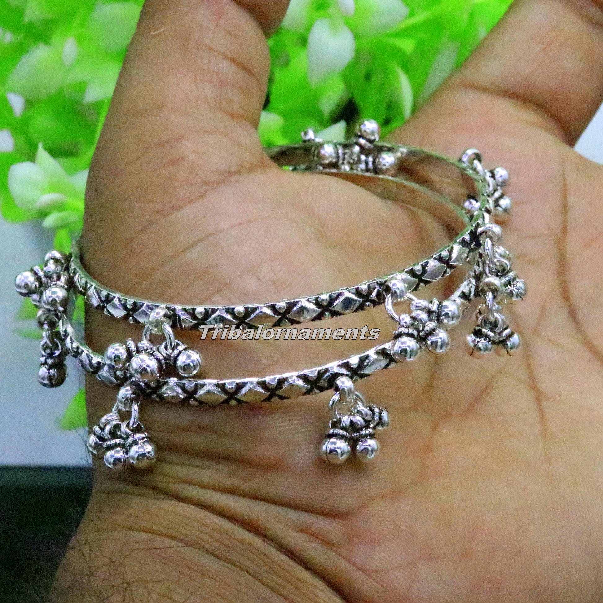 Sterling silver charm bangle bracelet by TRIBAL ORNAMENTS with oxidized finish, personalized belly dance jewelry with intricate design.