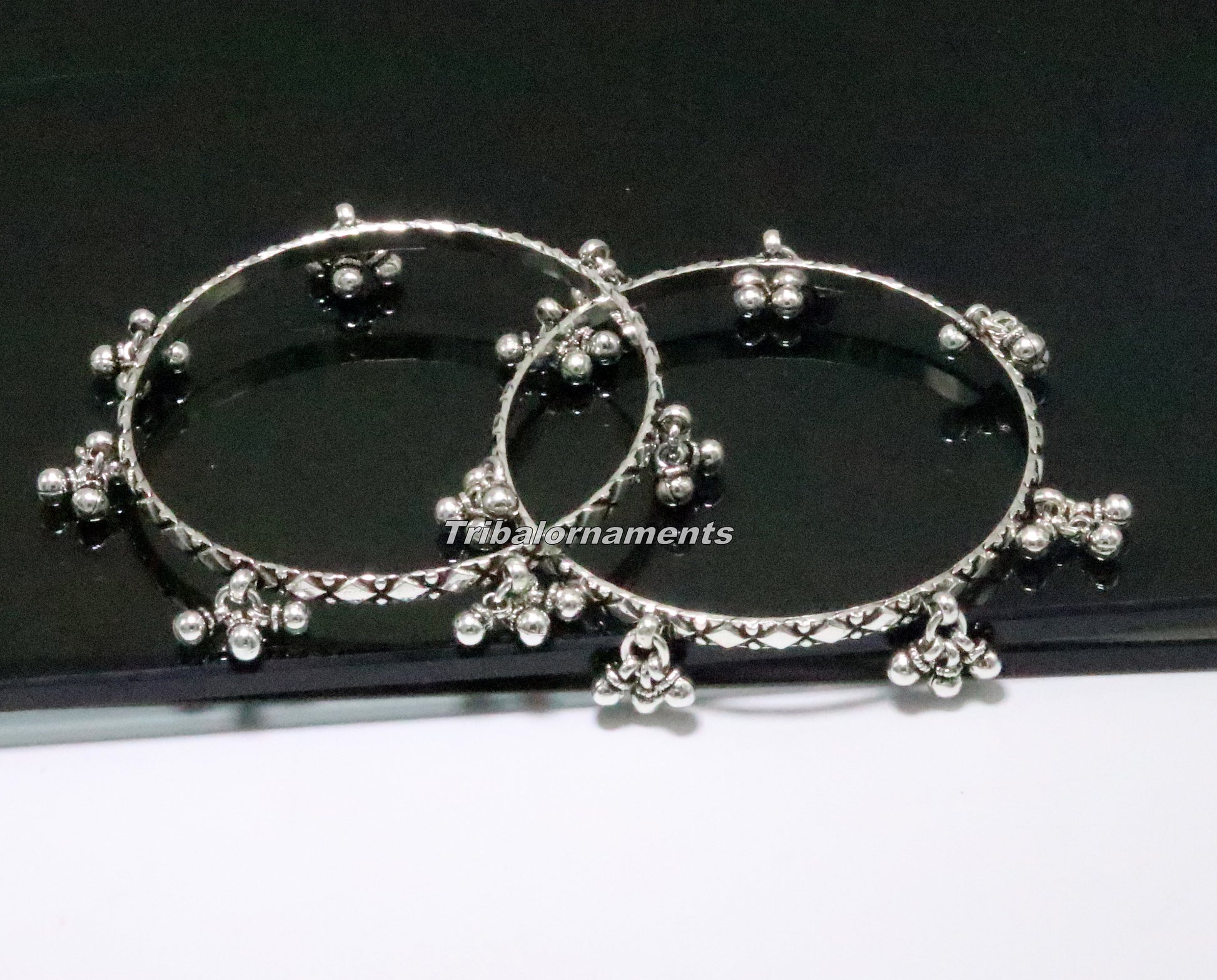 Sterling silver charm bangle bracelet by Tribal Ornaments, oxidized finish with personalized belly dance-inspired jewelry design.