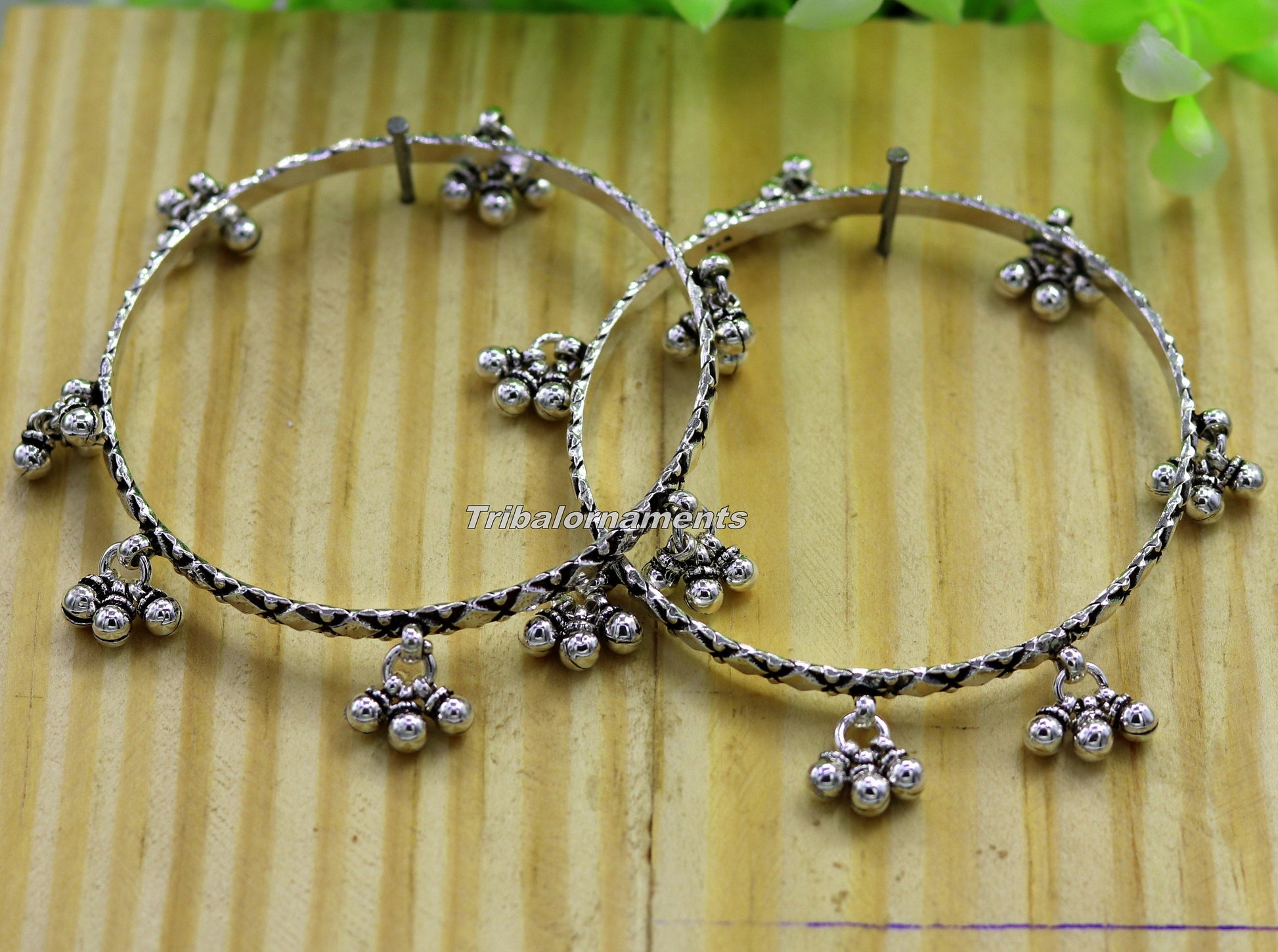 Sterling silver charm bangle bracelet by TRIBAL ORNAMENTS featuring oxidized, personalized belly dance jewelry design.