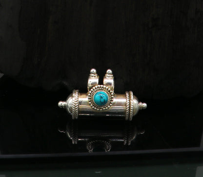 925 sterling silver tribal amulet pendant with vibrant turquoise stone in a box design, featuring intricate tribal jewelry details.