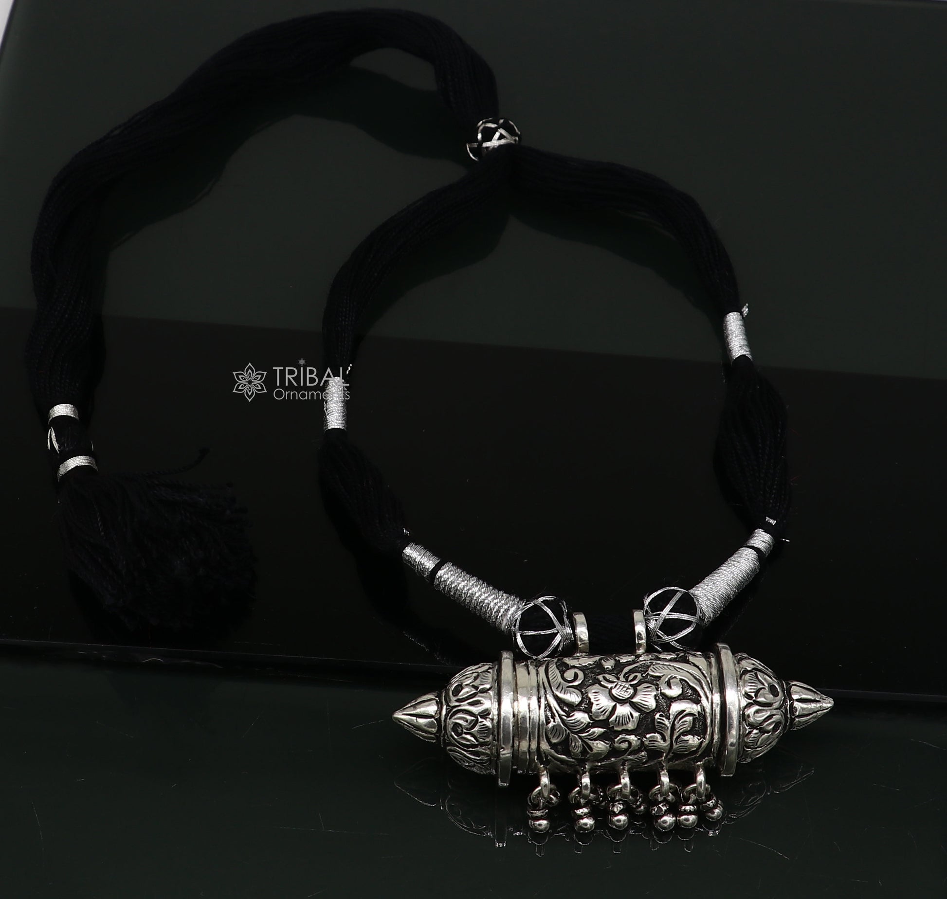 Sterling silver tribal Taviz pendant on ethnic necklace with adjustable back thread knot, featuring cultural mantra box jewelry set.