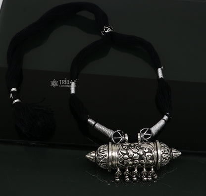 Sterling silver tribal Taviz pendant on ethnic necklace with adjustable back thread knot, featuring cultural mantra box jewelry set.
