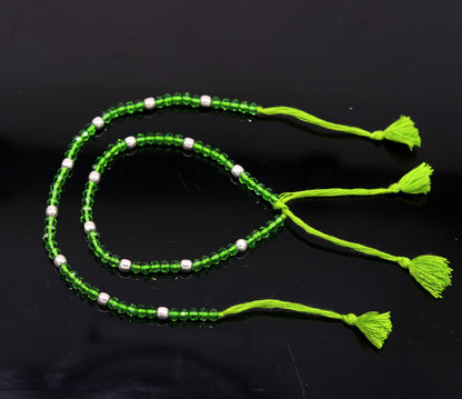 Sterling silver beads and semi-precious green stone thread anklet by Tribal Ornaments, custom-made jewelry for ankle decoration.