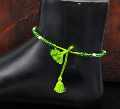 Sterling silver beads and semi-precious green stone thread anklet by TRIBAL ORNAMENTS, handcrafted modern beaded jewelry for ankles.