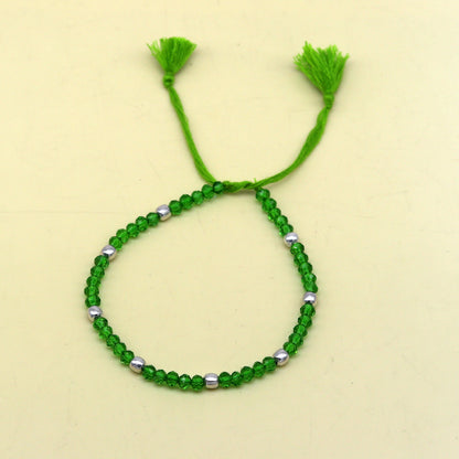 Sterling silver beads and semi-precious green stone thread anklet by TRIBAL ORNAMENTS, custom-made beaded jewelry for ankles.