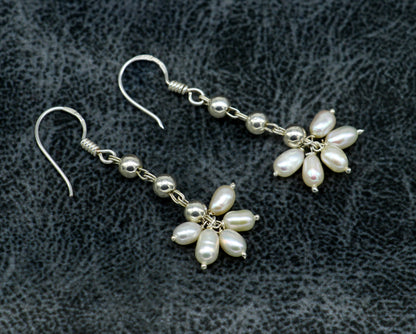Sterling silver hoop earrings with natural white pearl drops, custom-made bridesmaid pearl dangle earrings by TRIBAL ORNAMENTS.
