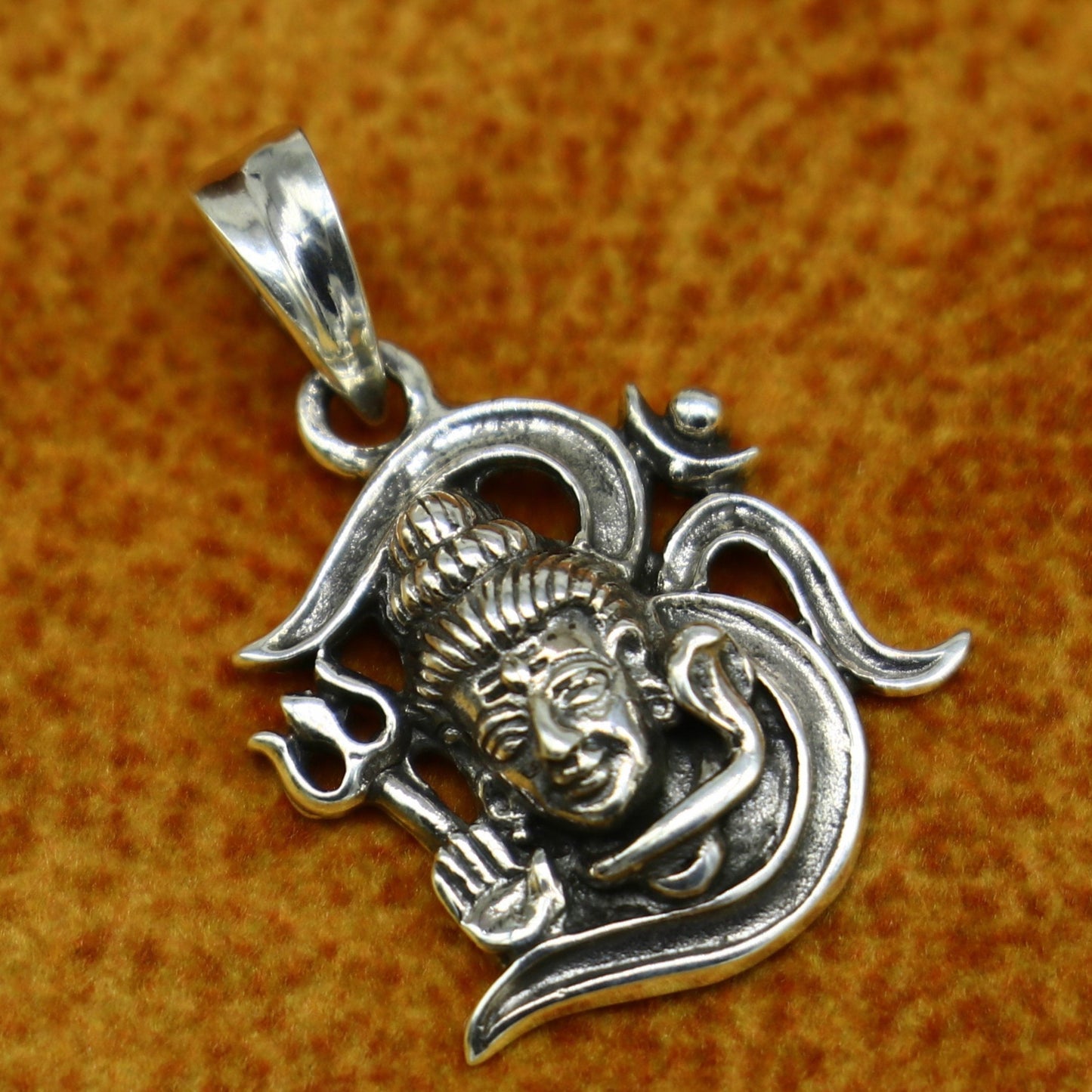 Sterling silver Lord Shiva pendant by TRIBAL ORNAMENTS, vintage-style unisex jewelry with intricate design and religious symbolism.