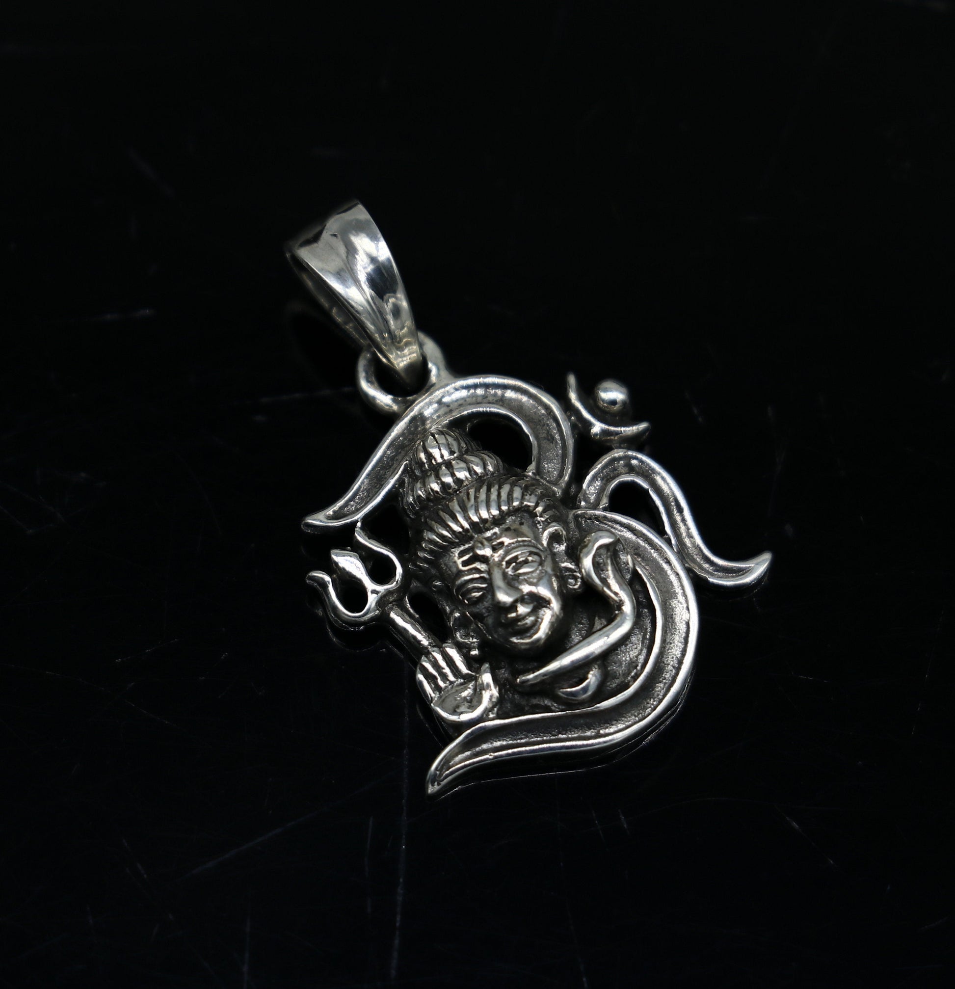 Sterling silver Lord Shiva pendant by TRIBAL ORNAMENTS featuring intricate vintage design, unisex jewelry for gifting or personal wear.