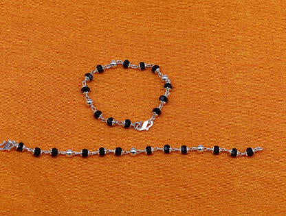 Sterling silver Nazariya bracelet with black beads from Tribal Ornaments, designed to protect against evil eyes for babies and stylish jewelry.