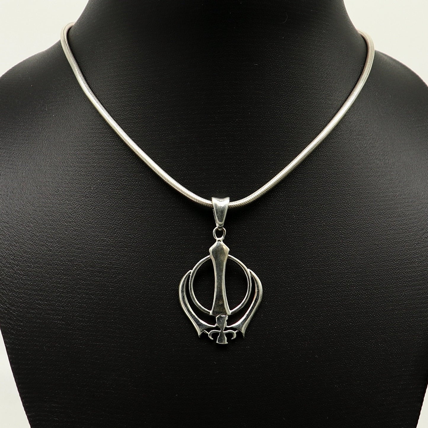 Sterling silver Khalsa Waheguru symbol pendant with customized design, featuring intricate Sikh logo craftsmanship from Tribal Ornaments.