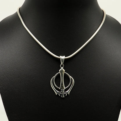 Sterling silver Khalsa Waheguru symbol pendant with customized design, featuring intricate Sikh logo craftsmanship from Tribal Ornaments.