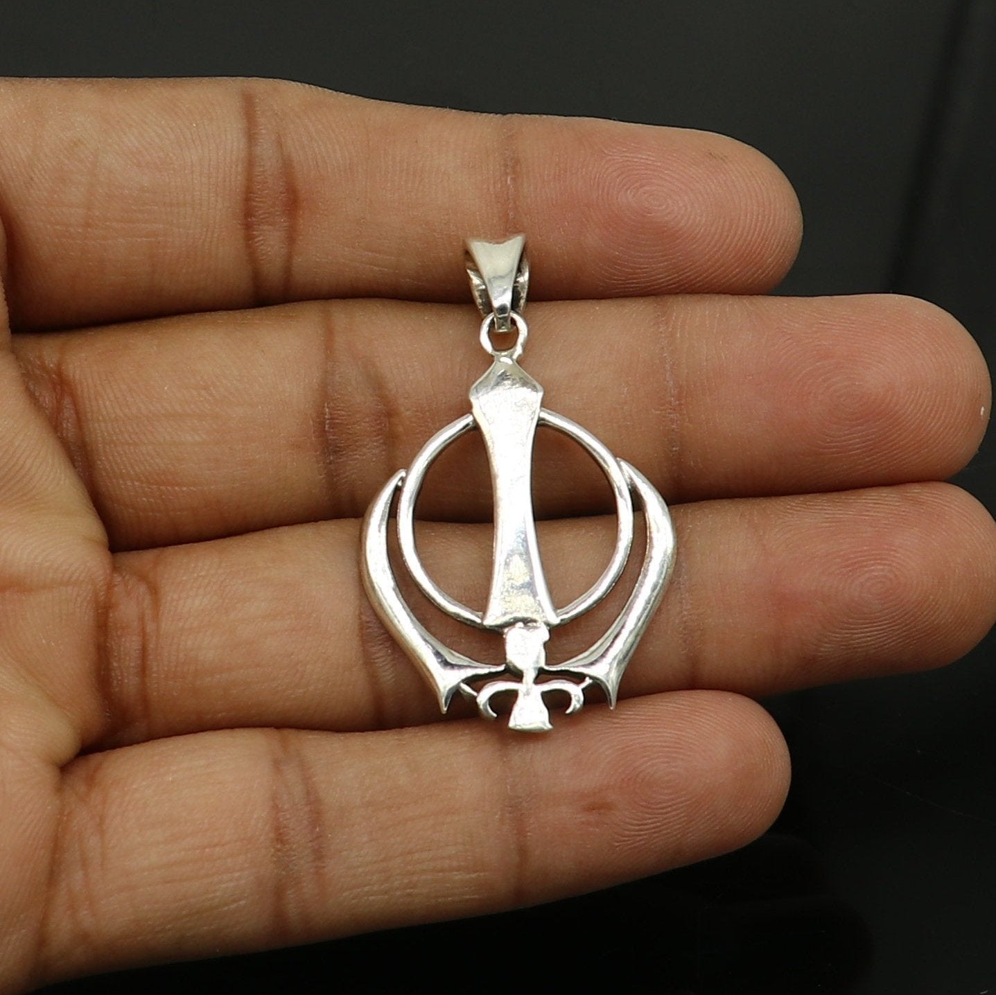 925 sterling silver Khalsa Waheguru symbol pendant with customized design, featuring intricate craftsmanship from Tribal Ornaments.