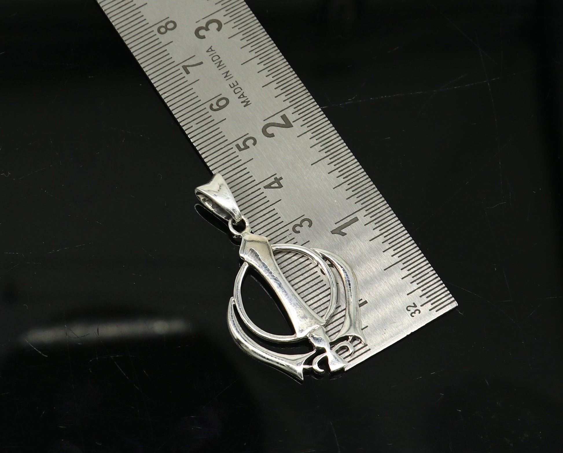 925 sterling silver Khalsa Waheguru symbol pendant with custom design, featuring Sikh blessing jewelry from TRIBAL ORNAMENTS.