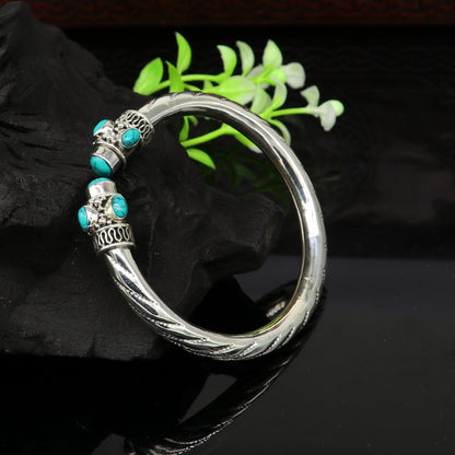 Sterling silver cuff bangle with vibrant blue turquoise stone, stylish tribal jewelry by TRIBAL ORNAMENTS.