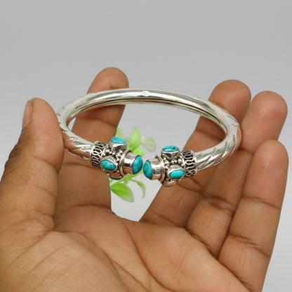 Sterling silver cuff bangle with blue turquoise stone from TRIBAL ORNAMENTS, showcasing a customizable, stylish jewelry piece.