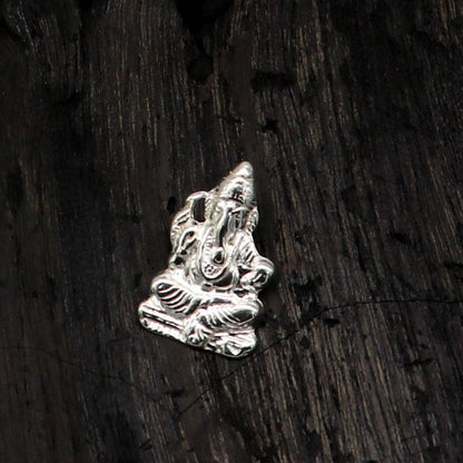 Sterling silver Ganesha idol pendant from Tribal Ornaments, unisex jewelry with intricate design and customizable details.