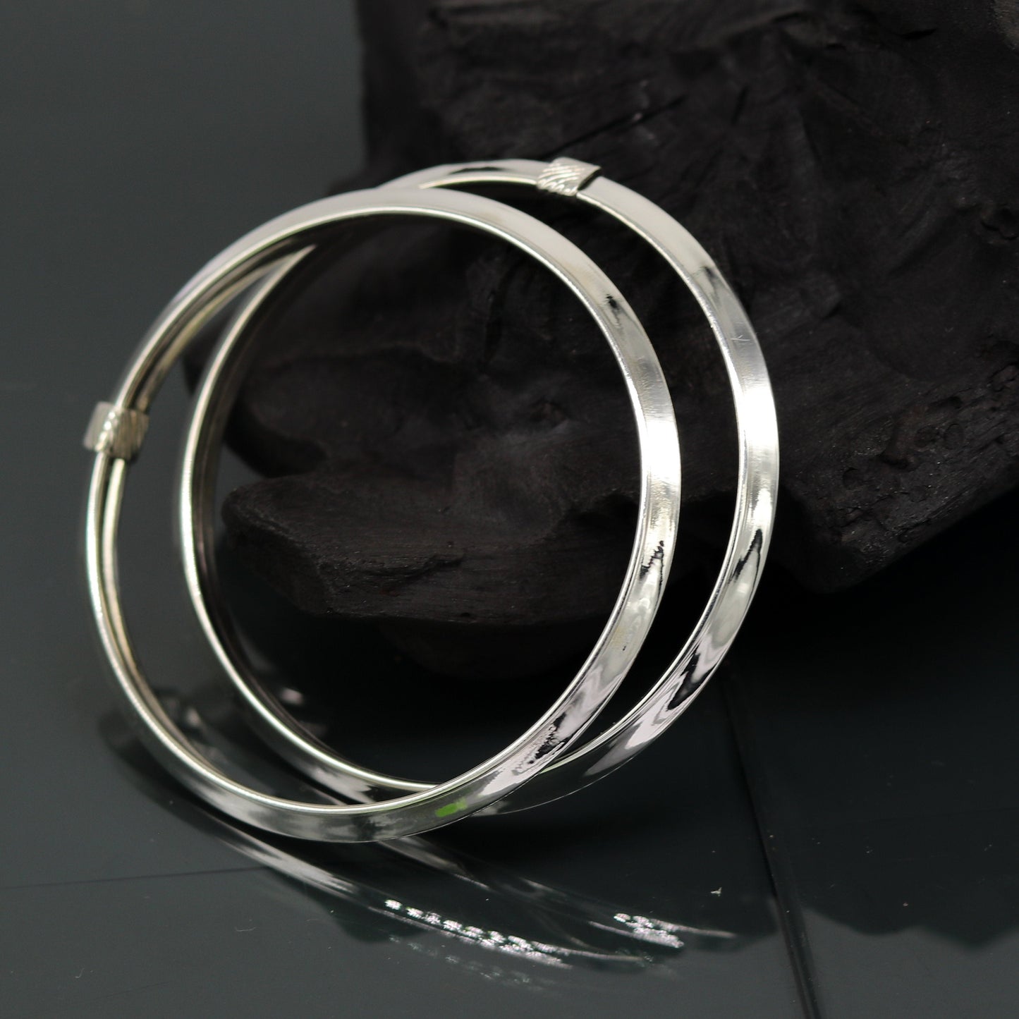 Sterling silver customized bangle bracelet by TRIBAL ORNAMENTS, shiny, stylish, flexible tribal jewelry kada with intricate design.