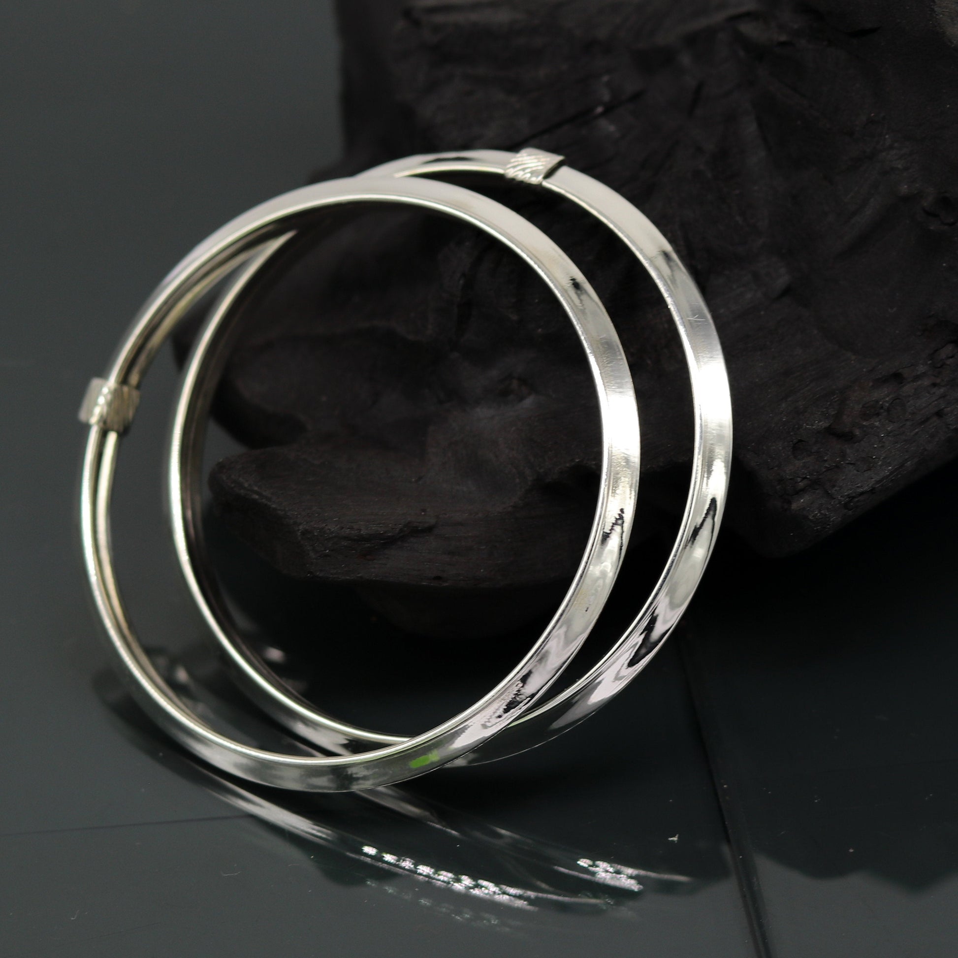 Sterling silver customized bangle bracelet by TRIBAL ORNAMENTS, shiny, stylish, flexible tribal jewelry kada with intricate design.
