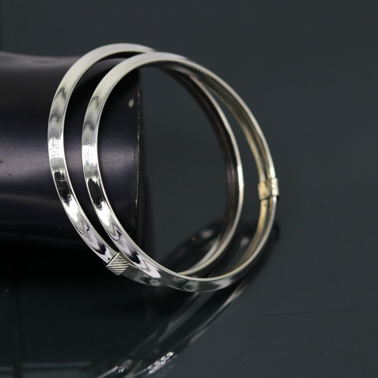 Sterling silver customized shiny flexible bangle bracelet with tribal design, stylish and elegant jewelry by TRIBAL ORNAMENTS.