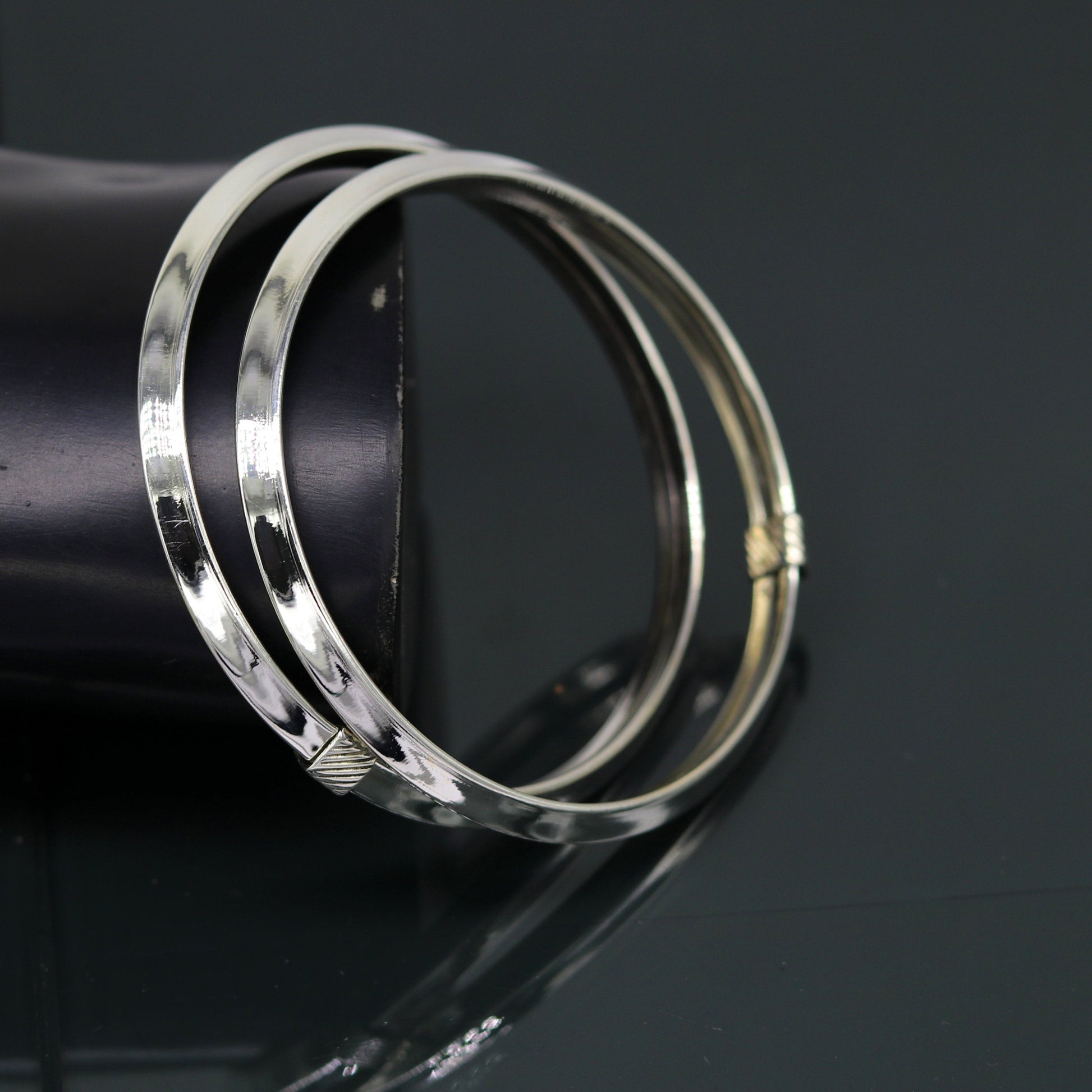 Sterling silver customized shiny flexible bangle bracelet with tribal design, stylish and elegant jewelry by TRIBAL ORNAMENTS.