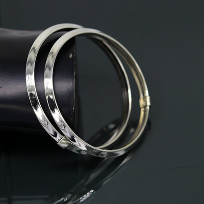 Sterling silver customized shiny flexible bangle bracelet with tribal design, stylish and elegant jewelry by TRIBAL ORNAMENTS.