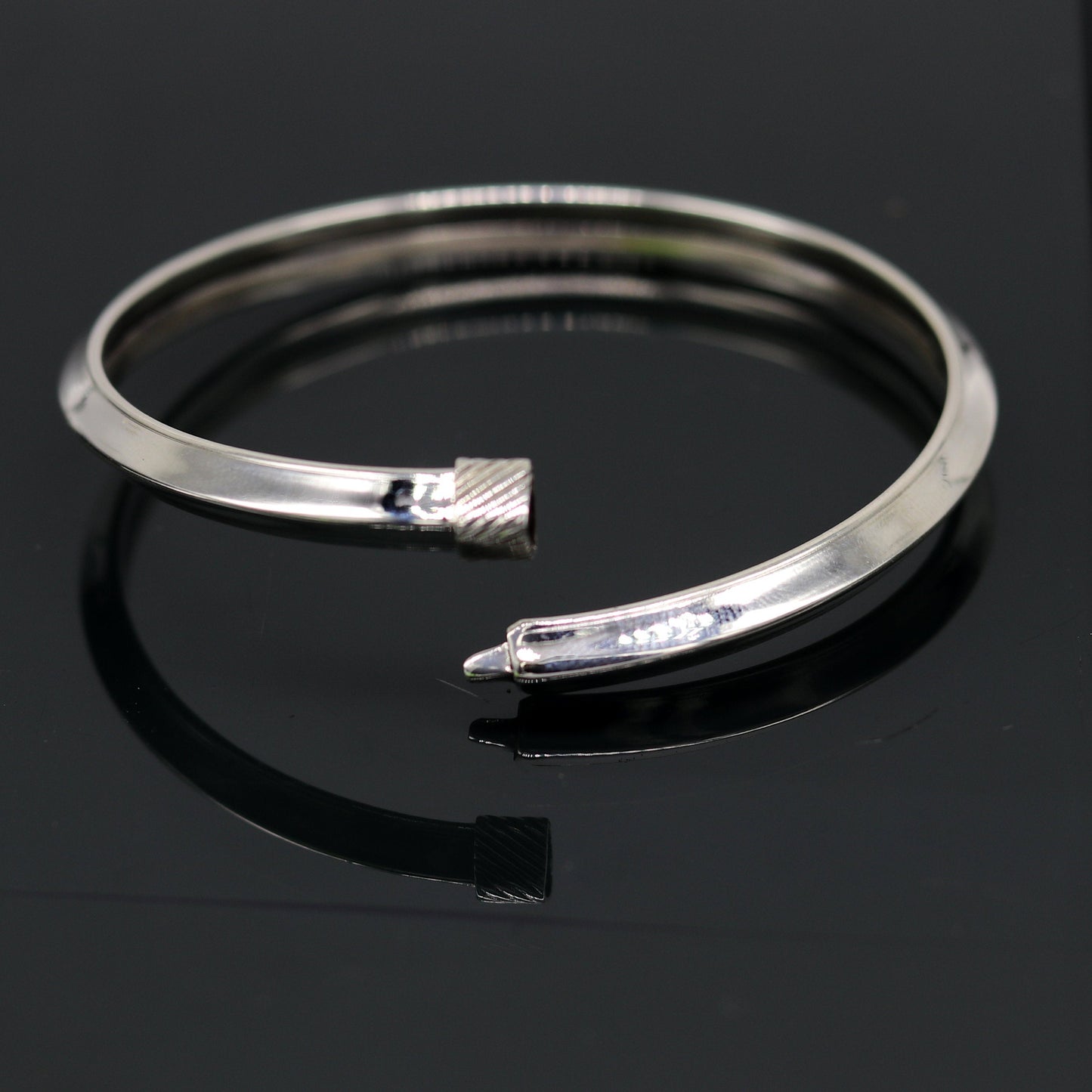 Sterling silver customized bangle bracelet with shiny, stylish, flexible design, tribal jewelry by TRIBAL ORNAMENTS.