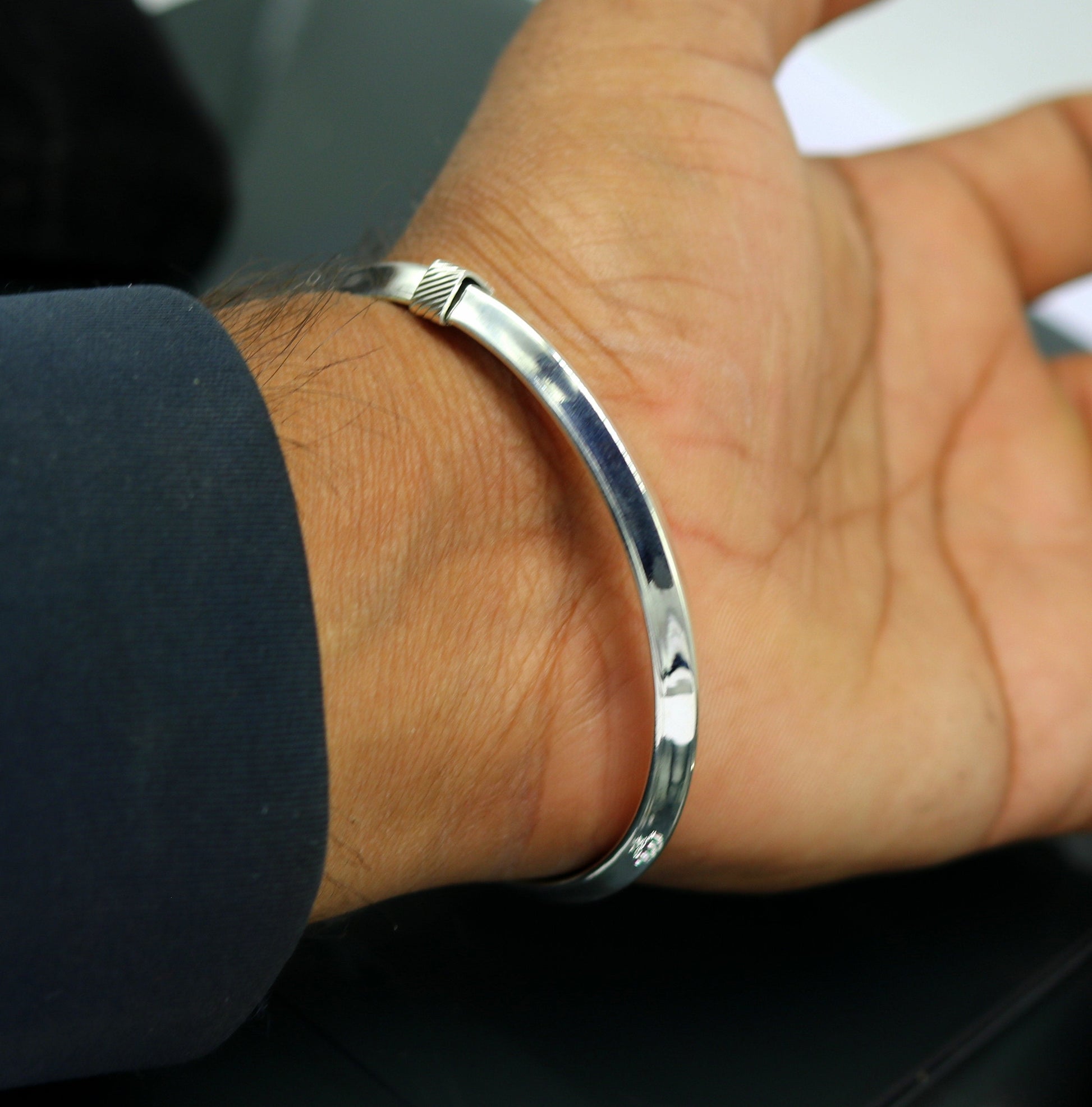 Shiny 925 sterling silver customizable tribal bangle bracelet with a sleek, flexible design from Tribal Ornaments.