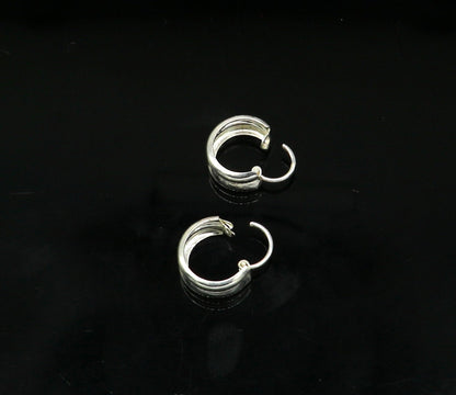 Sterling silver traditional Indian style hoops earring by TRIBAL ORNAMENTS, lightweight unisex design with intricate craftsmanship.