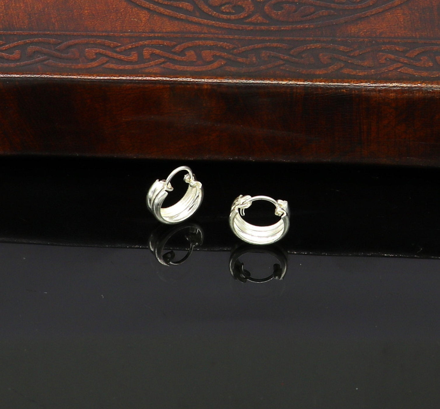 Sterling silver traditional Indian style hoop earrings by TRIBAL ORNAMENTS, lightweight and unisex with intricate design details.