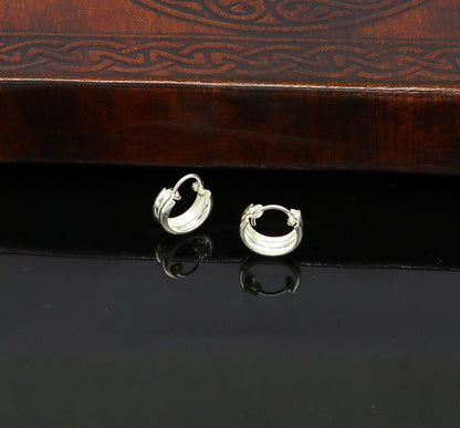 Sterling silver traditional Indian style hoop earrings by TRIBAL ORNAMENTS, lightweight and unisex with intricate design details.